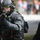 A police officer shoots non-lethal rounds at demonstrators during a protest on June 4, 2017, in Portland, Oregon.
